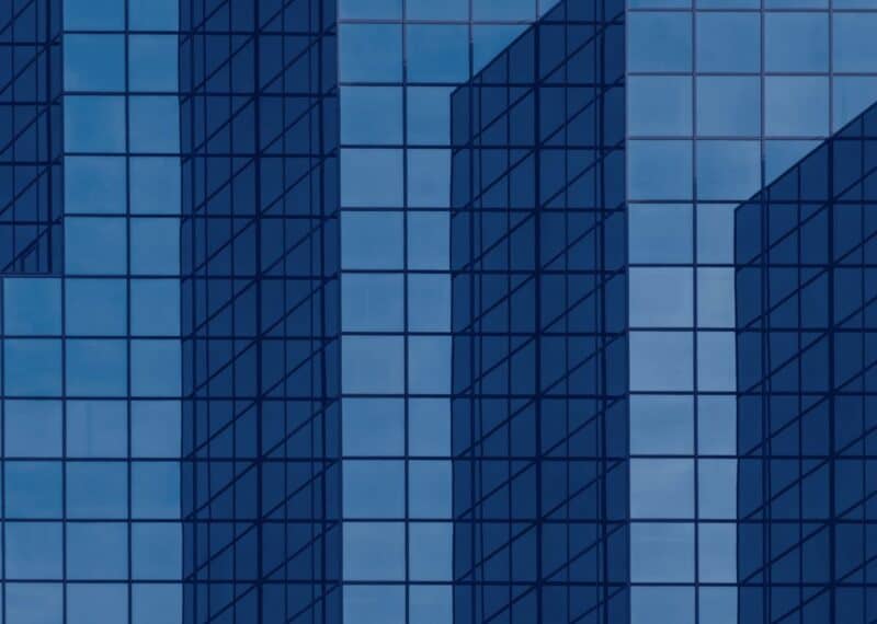blue glass office building facade representing investment consultant regulation in Bulgaria