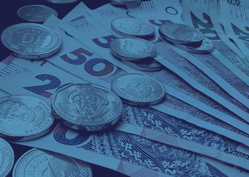 foreign income tax Bulgaria - tax residency and reporting, blue toned image depicting currency.